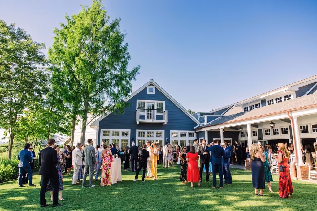 Guests on the lawn outside the waterfront Sunset Ballroom at Chesapeake Bay Beach Club