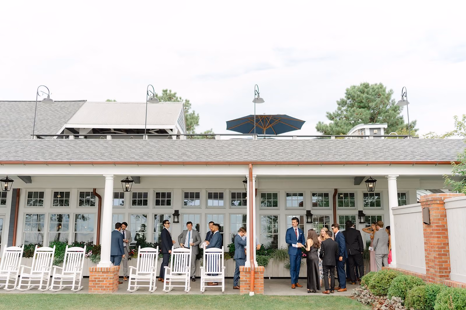 Guests on the Sunset Ballroom rooftop deck overlooking the Chesapeake Bay at the Beach Club