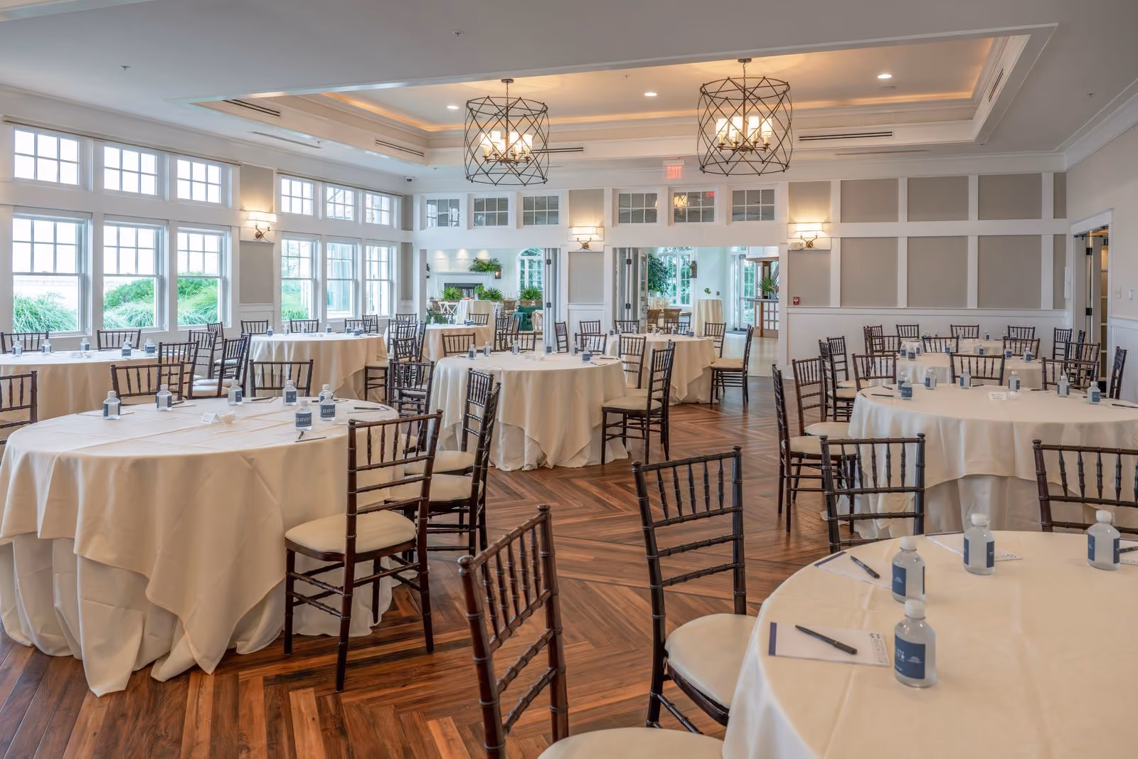 Sunset Ballroom set with round banquet tables and natural light at Chesapeake Bay Beach Club