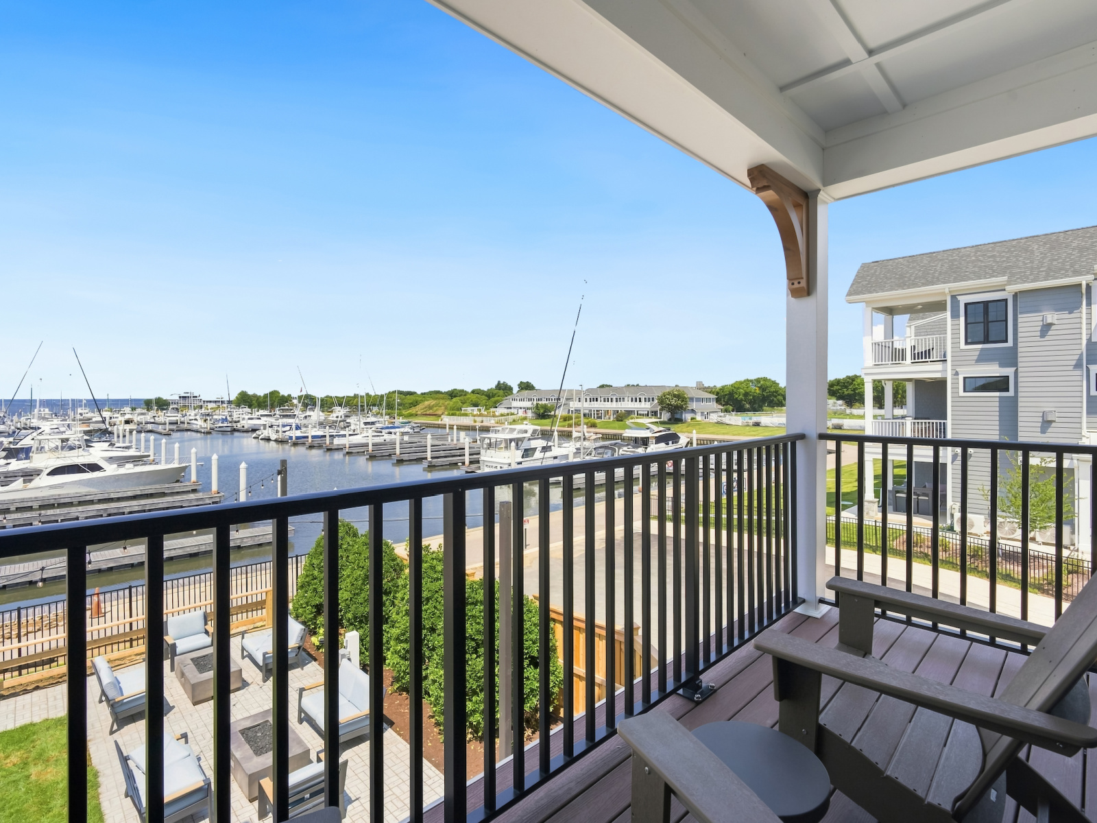 Private balcony at Wilson’s Cove Mariner Suite overlooking Bay Bridge Marina.