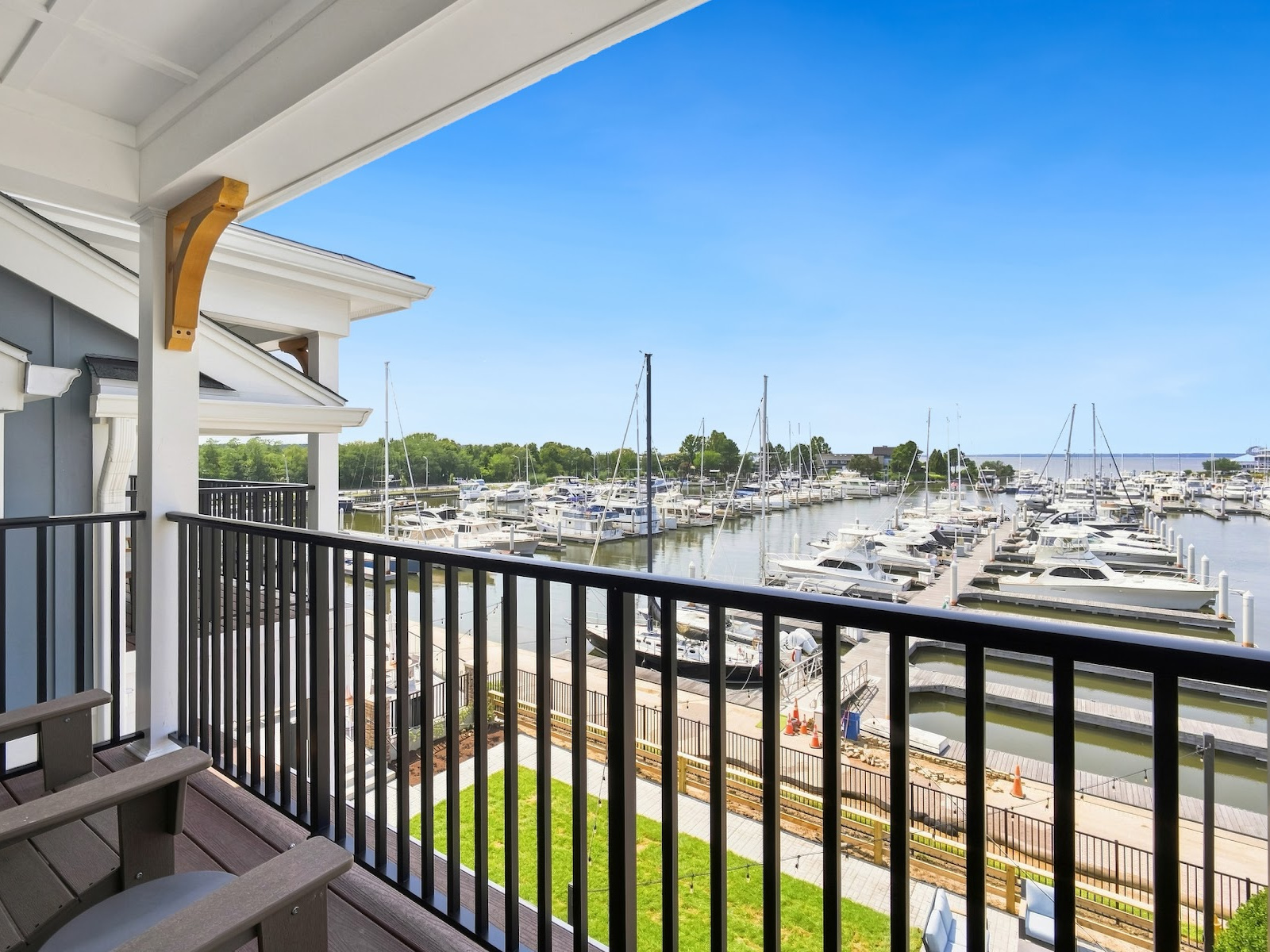 Private west-facing balcony at Wilson’s Cove Anchor Suite overlooking Bay Bridge Marina and the Chesapeake Bay.