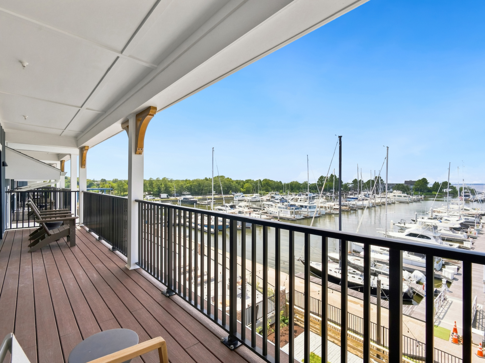 Expansive private balcony at Wilson’s Cove Harbor Suite overlooking Bay Bridge Marina and the Chesapeake Bay.