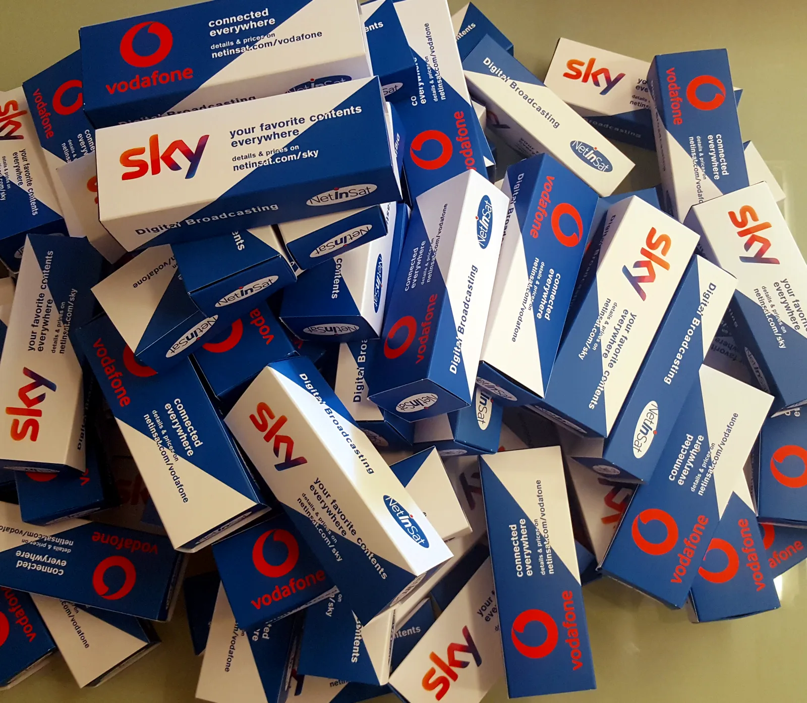 NetInSat promotional boxes with Sky cards and Vodafone SIMs, handed out in marinas