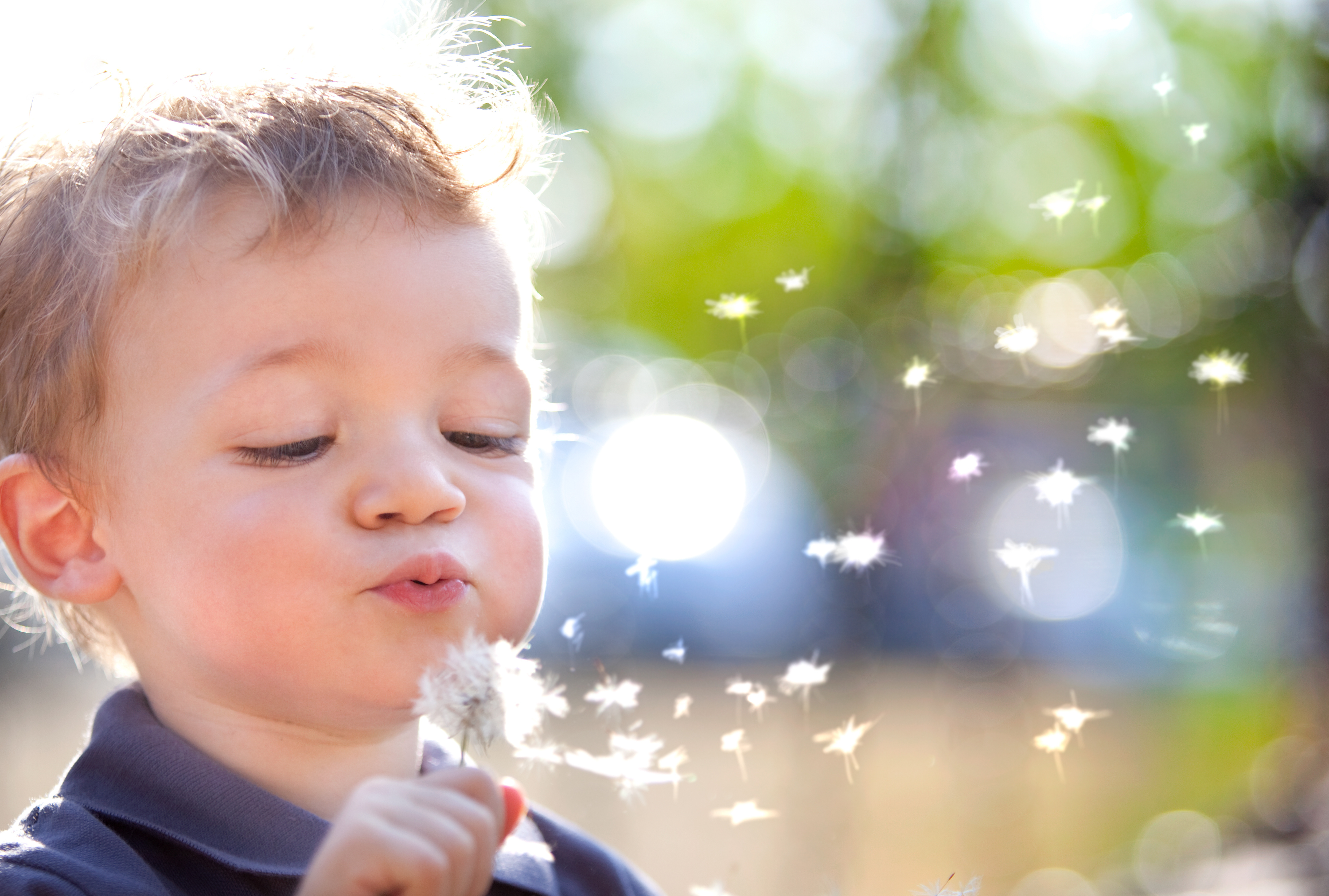 Little boy blowing bubbles