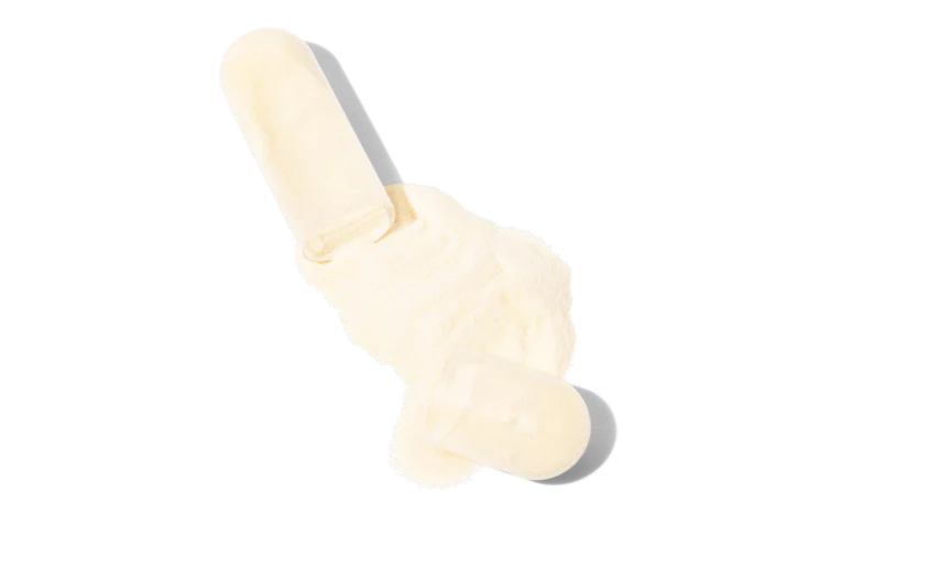 Two white capsules spilling white powder on a transparent background.