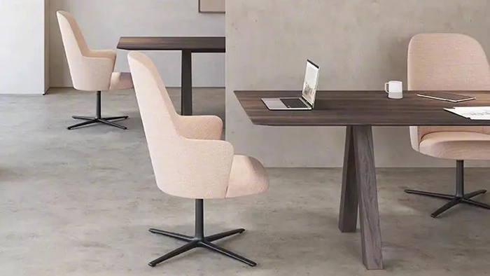 Ergonomic executive office chair with adjustable features on a rolling base in a clean studio setting