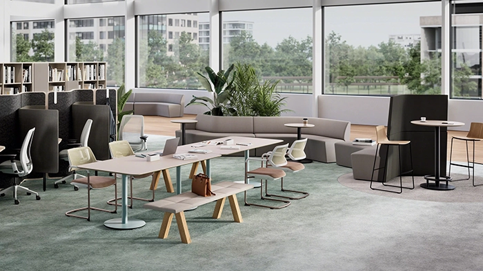 Conference room with large meeting table, chairs, and display screen in a professional office setting