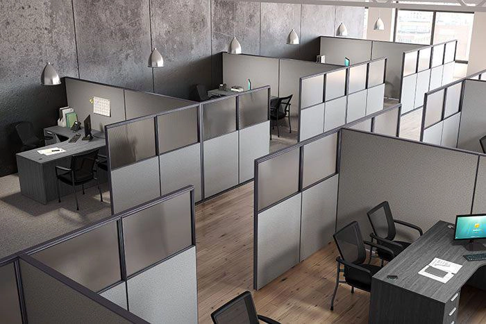 Cubicle office layout with partitioned workstations, desks, and task chairs in a structured office environment