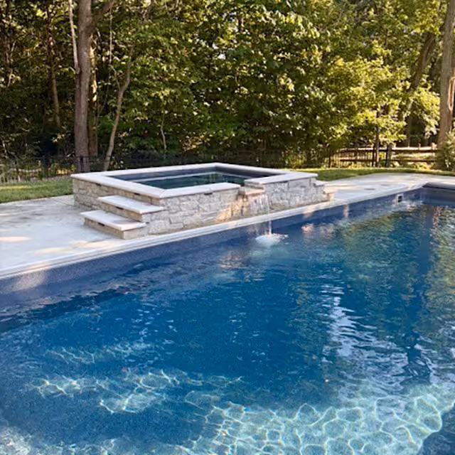 Custom poolside outdoor living by RFS Lawn and Landscapes in West Chester Ohio
