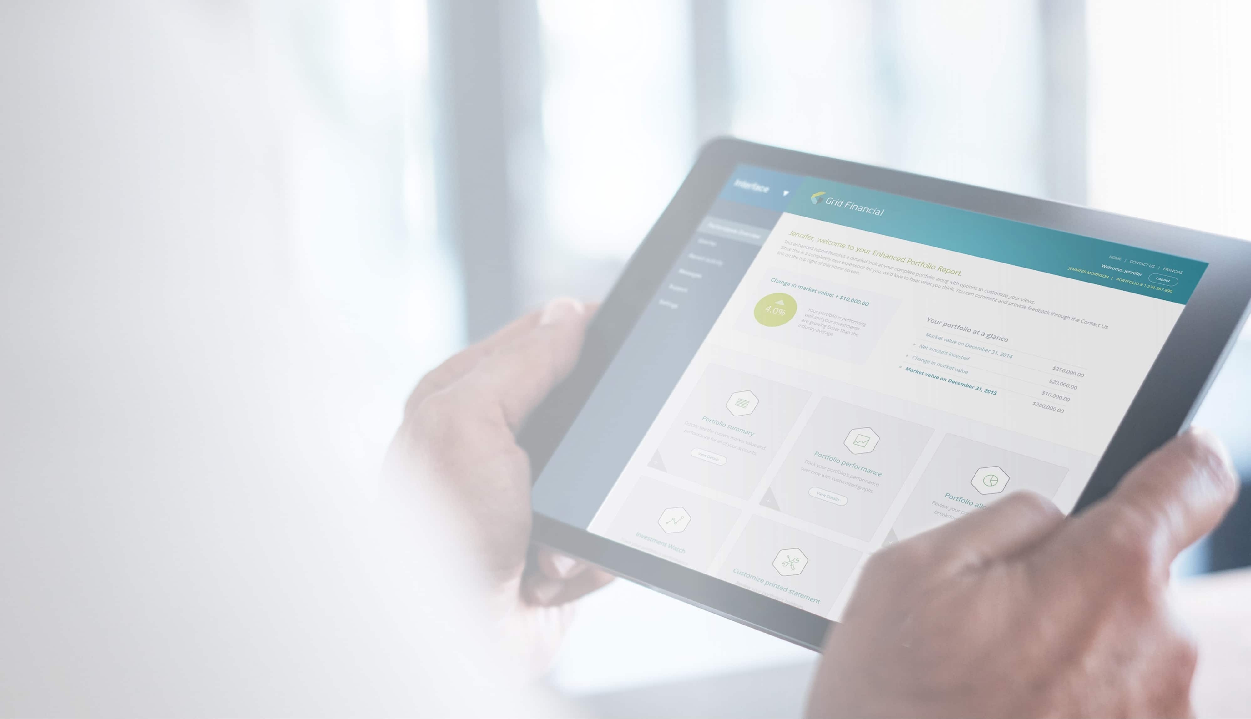 Person holding a tablet displaying a financial portfolio report interface from Grid Financial.