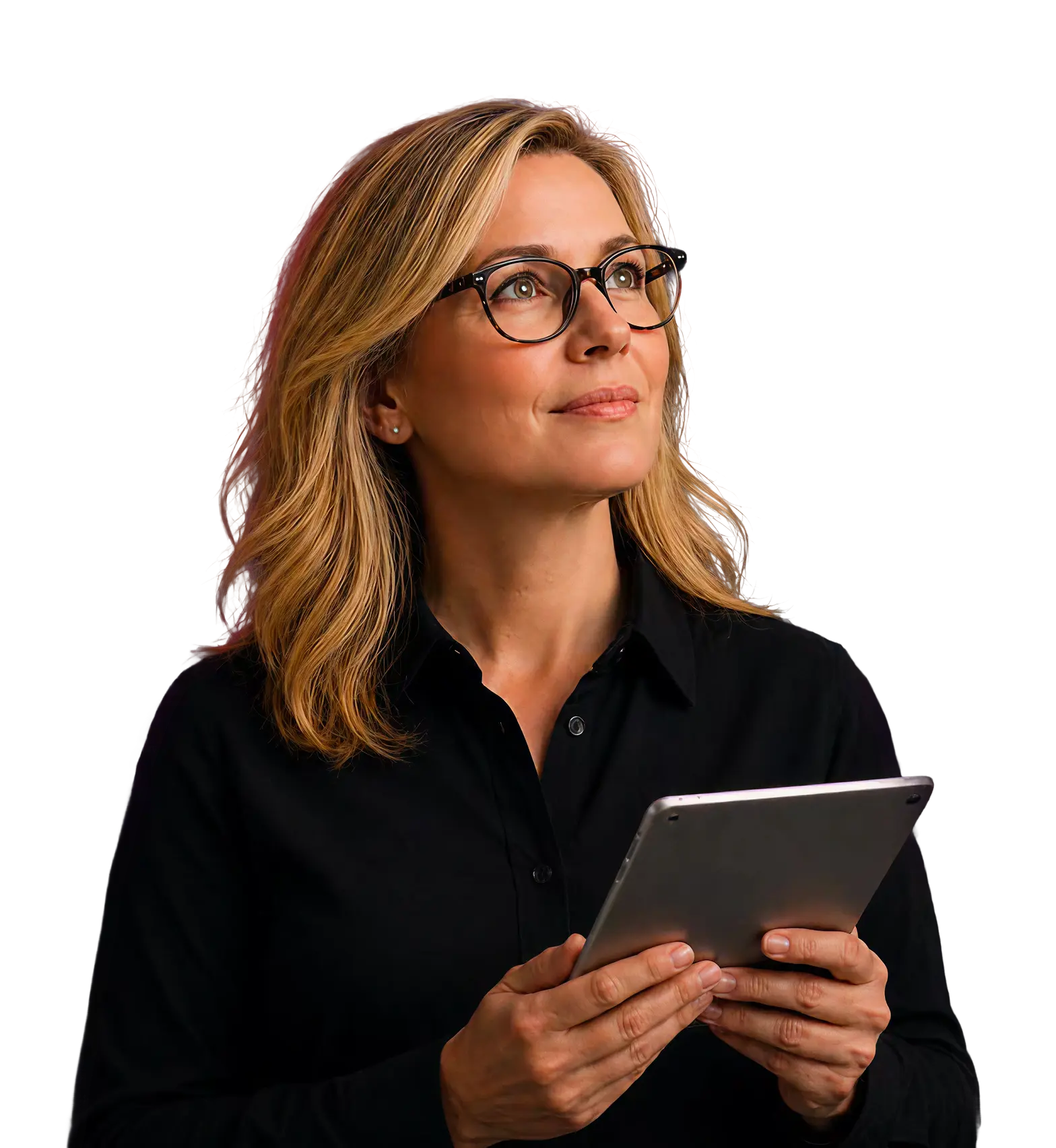 Blonde woman in glasses holding a tablet and looking thoughtfully upwards.