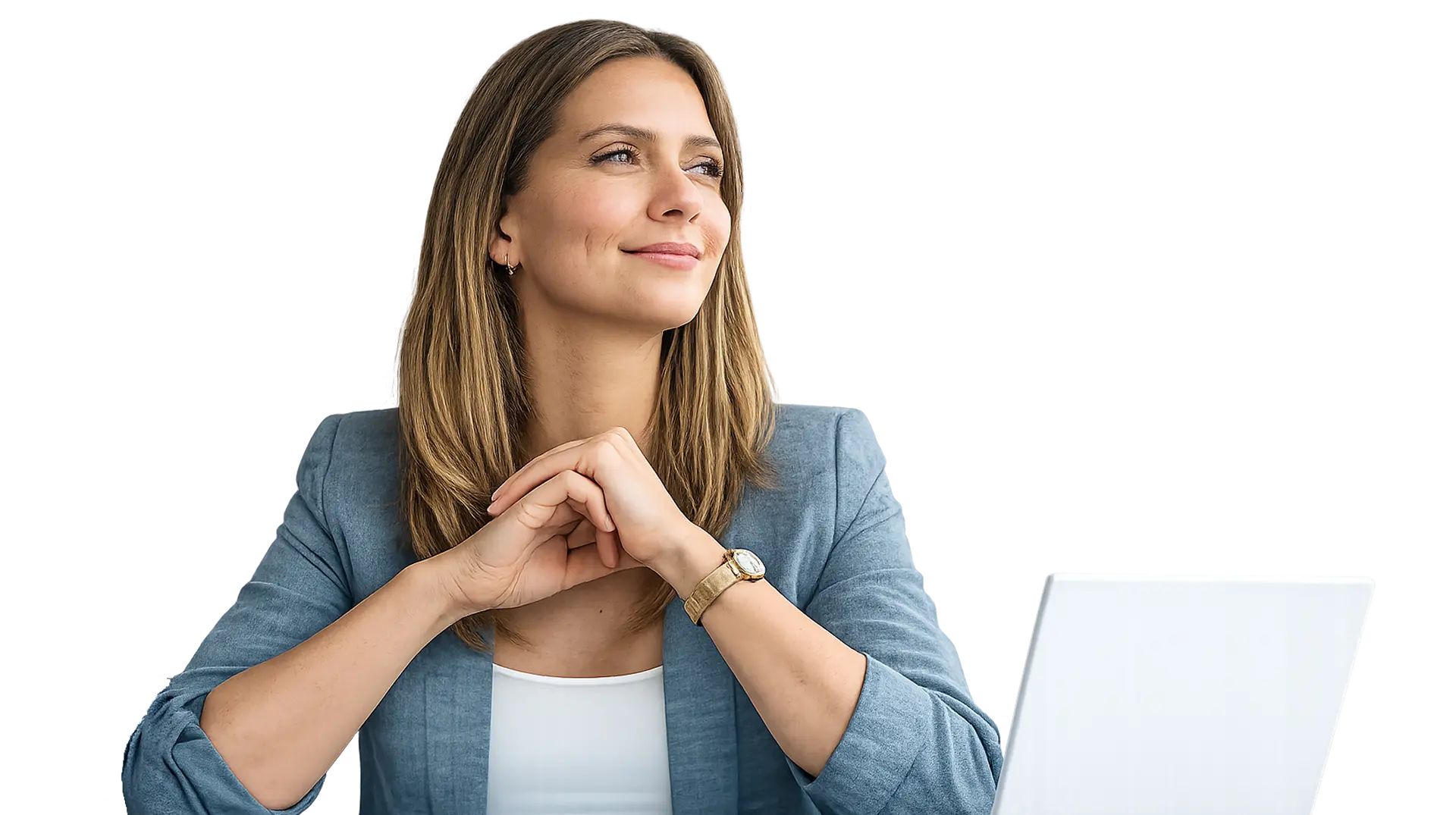 Smiling businesswoman in blue blazer sitting with hands clasped near white laptop.