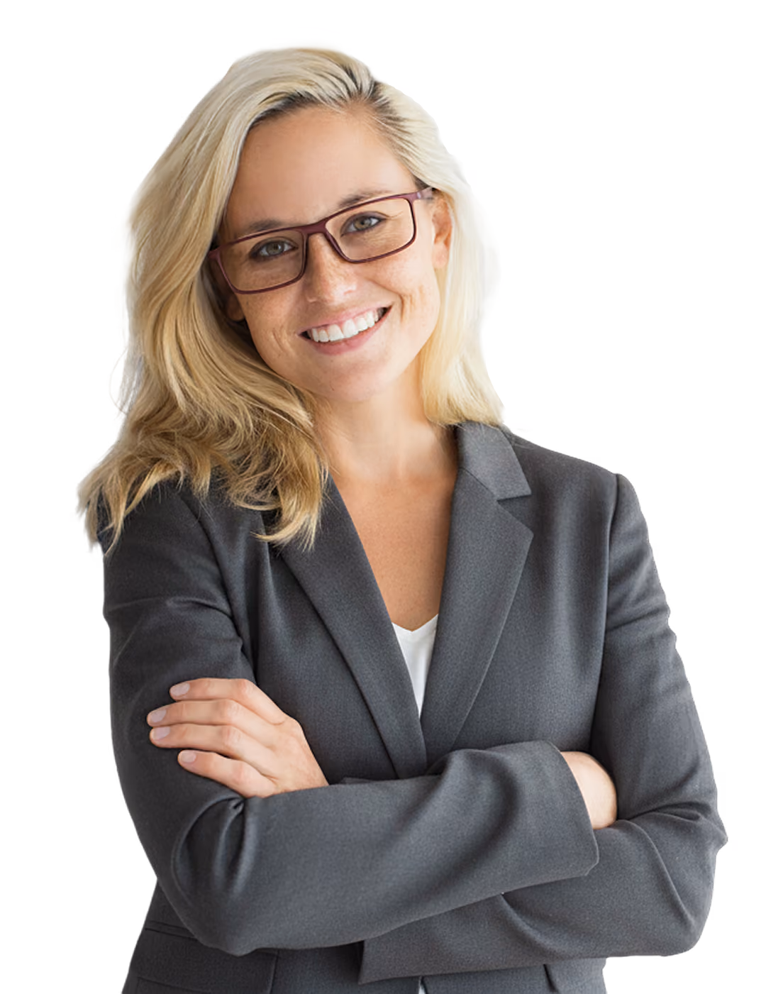 Smiling businesswoman with glasses in a grey blazer standing with her arms crossed