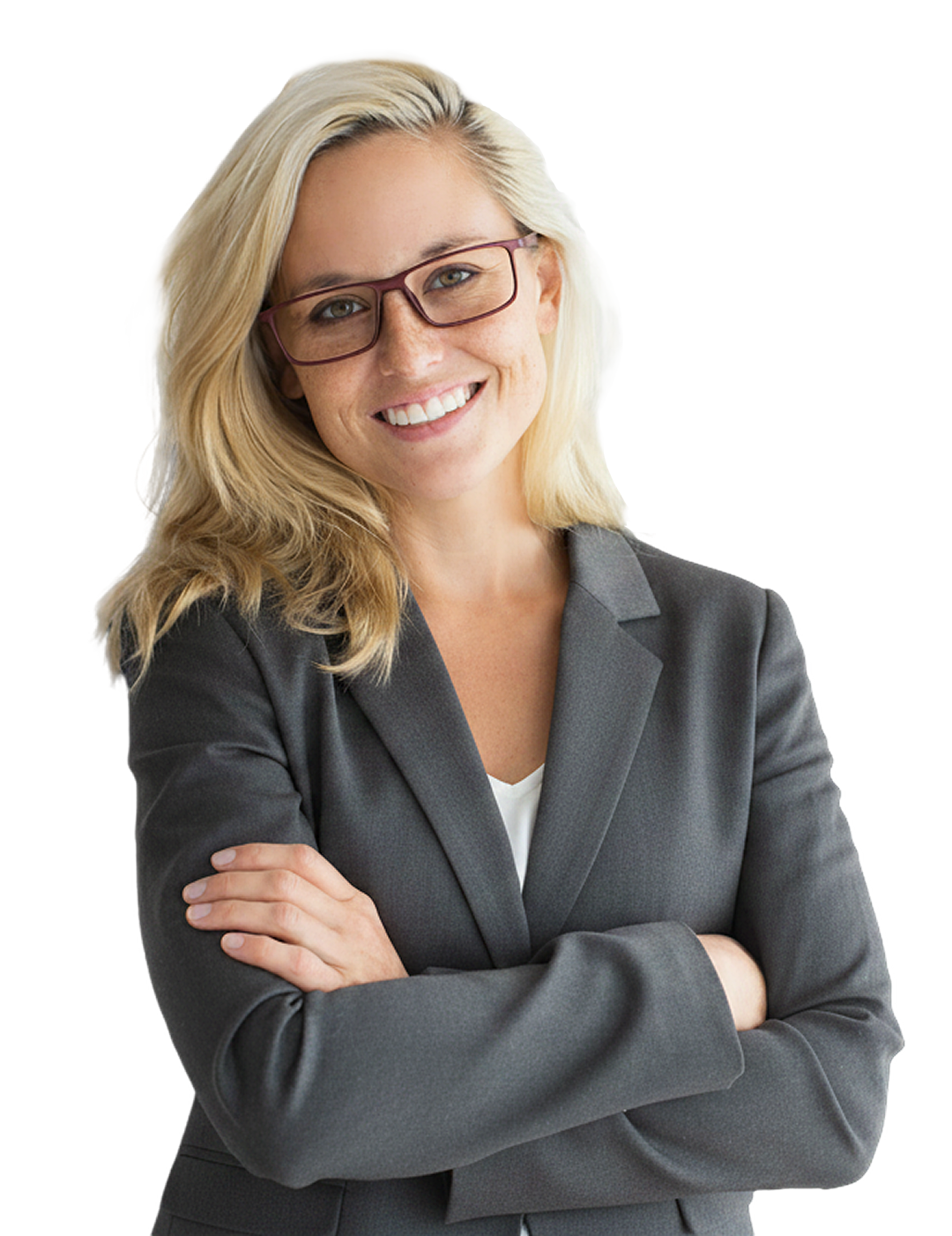 Smiling businesswoman with glasses in a grey blazer standing with her arms crossed