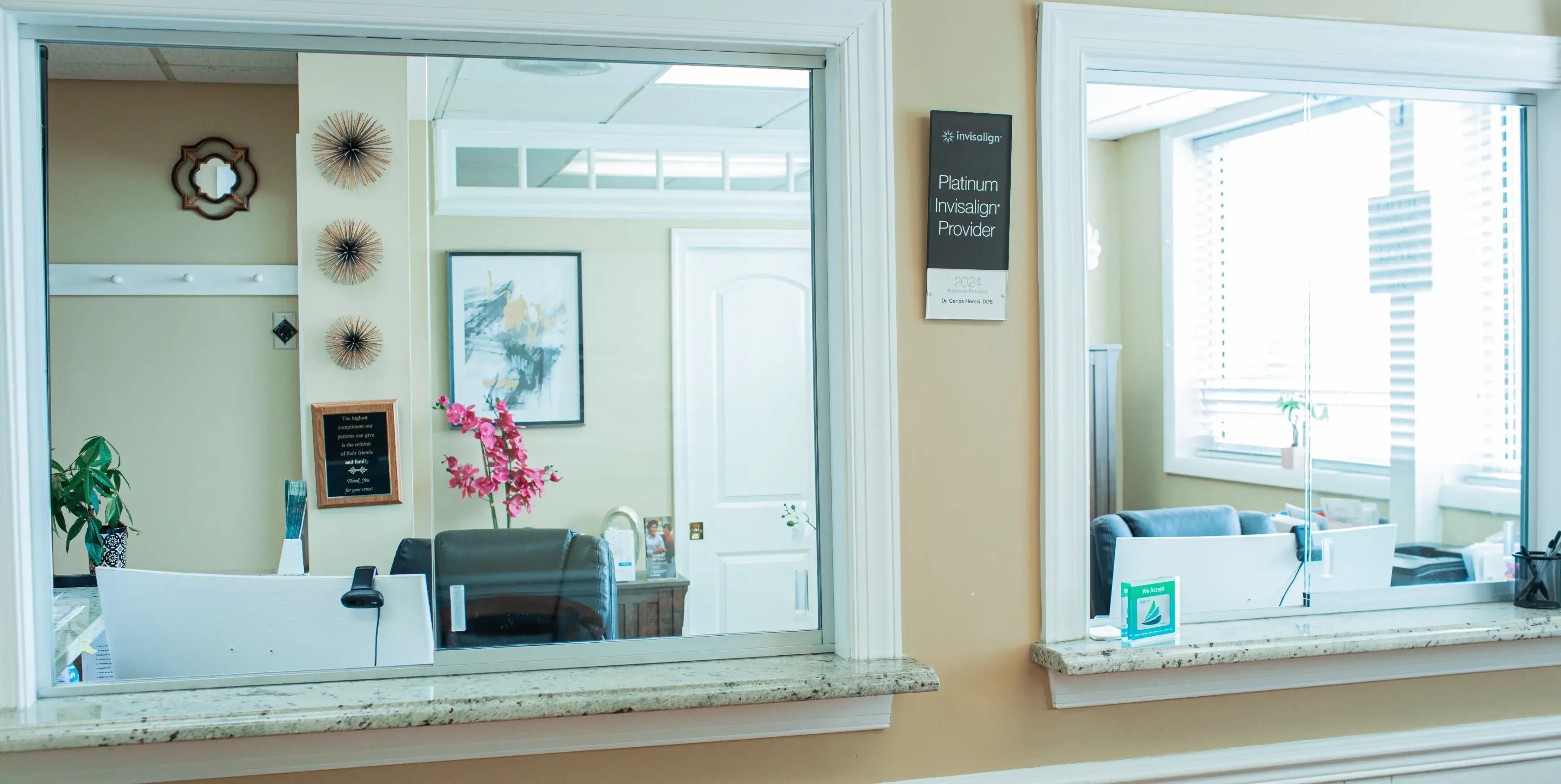 A bathroom mirror reflecting a hair salon.