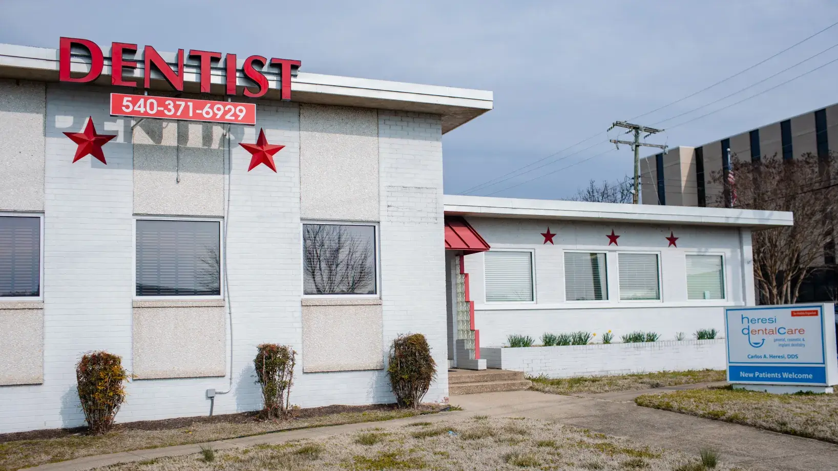 A white building with red stars on it.