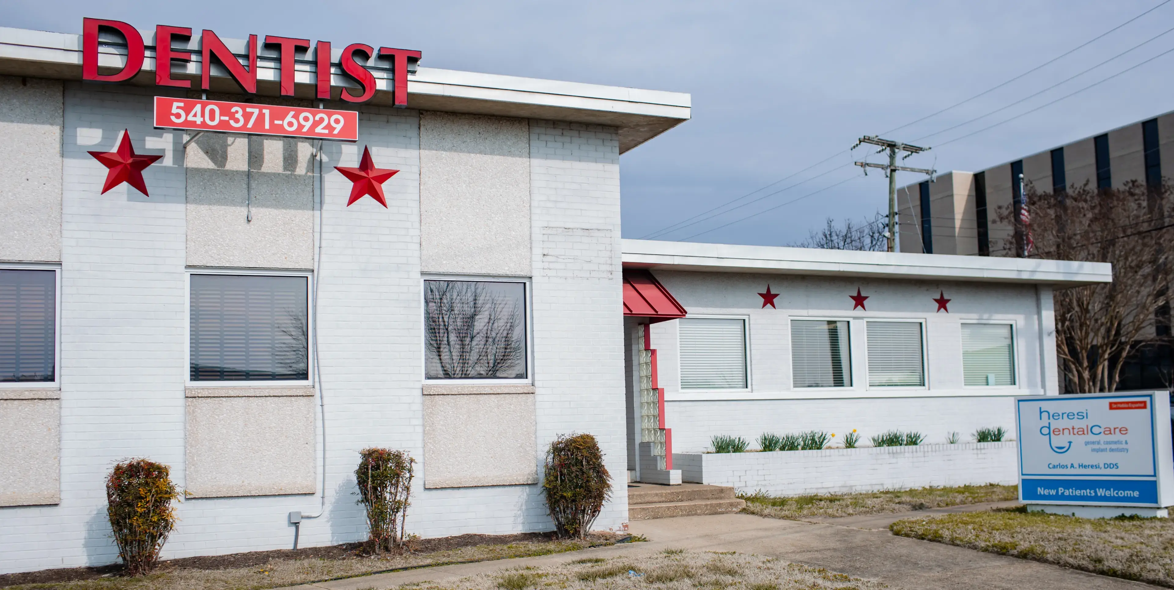 A white building with red stars on it.