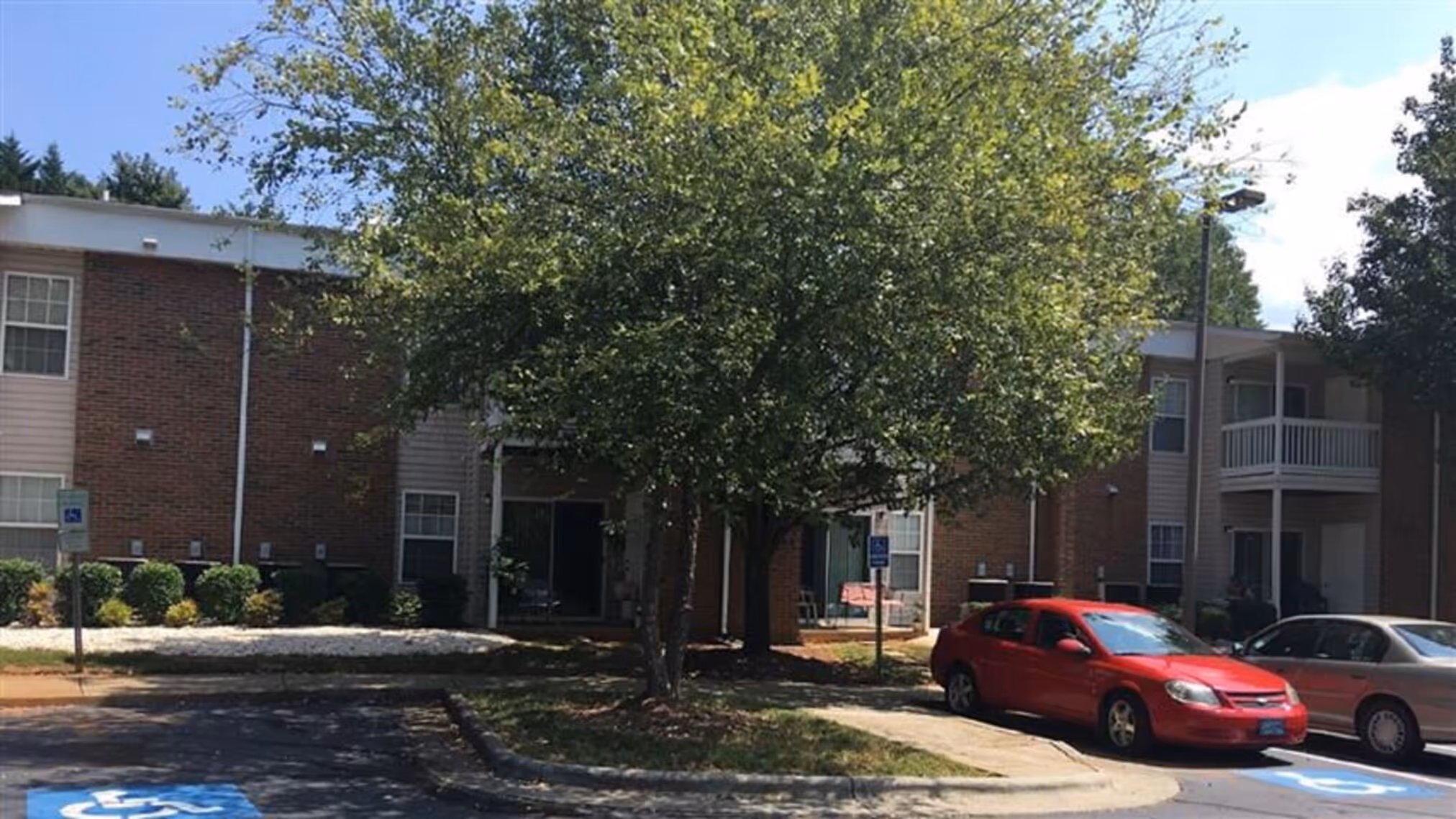 Exterior apartment community with landscaping