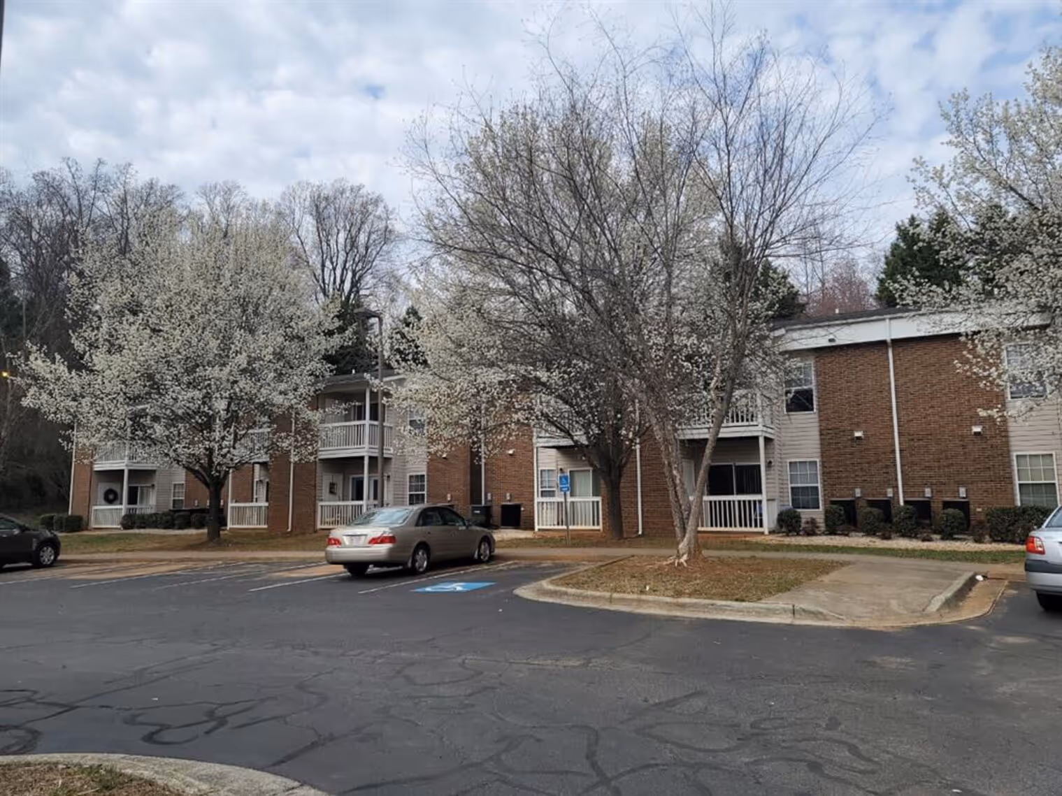 Exterior apartment community with landscaping