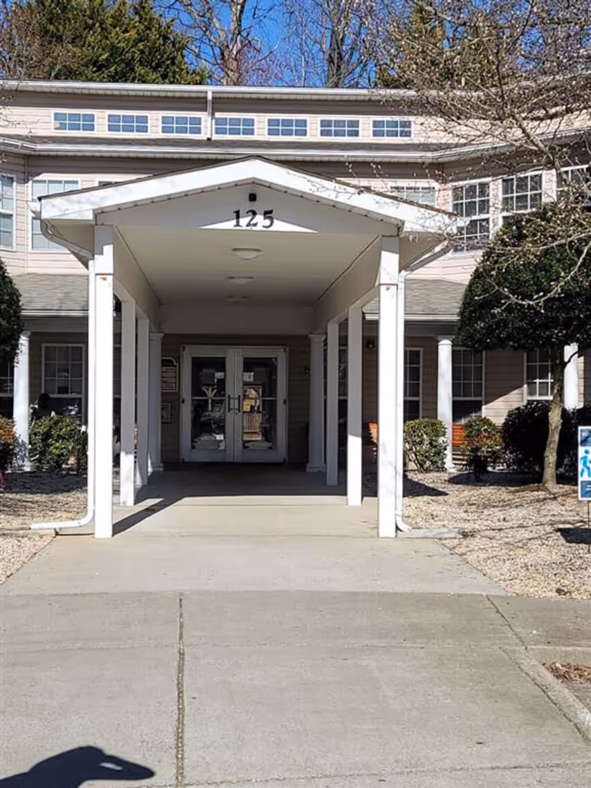 Exterior apartment community with landscaping