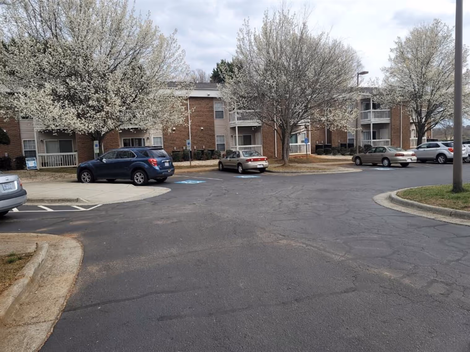 Exterior apartment community with landscaping