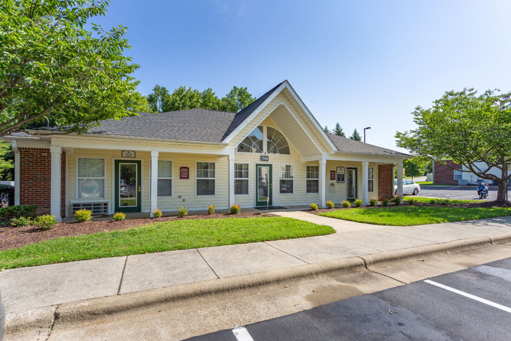 Exterior apartment community with landscaping