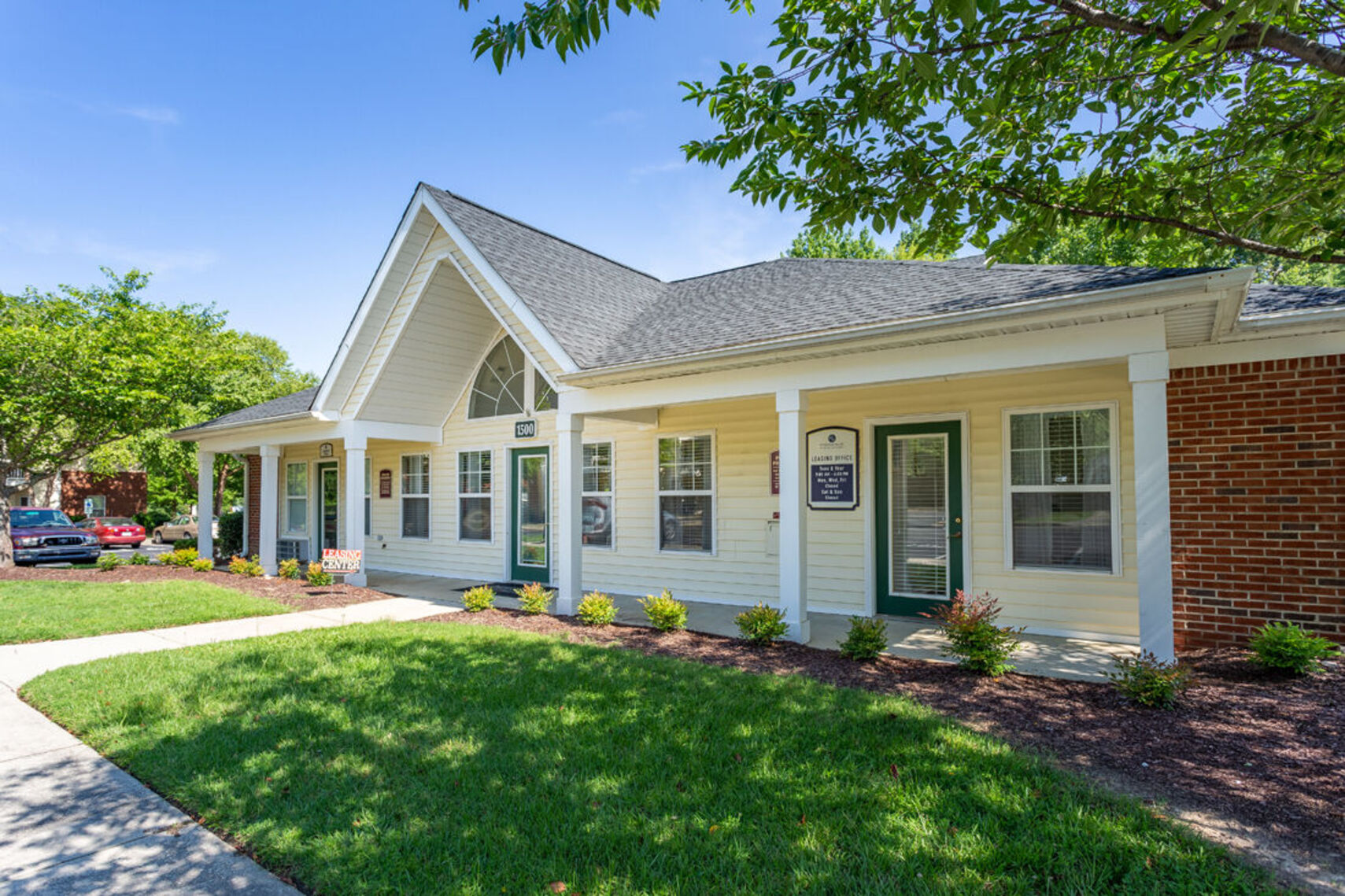 Exterior apartment community with landscaping