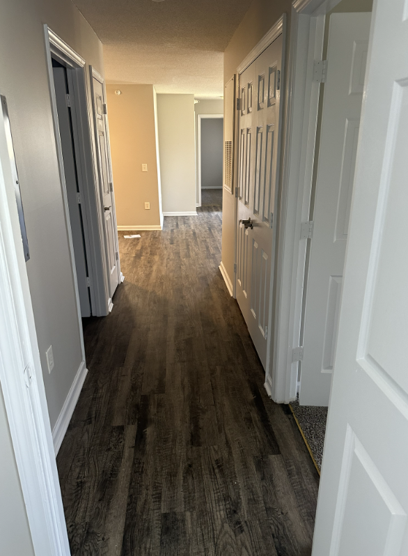 Hallway with wood floors
