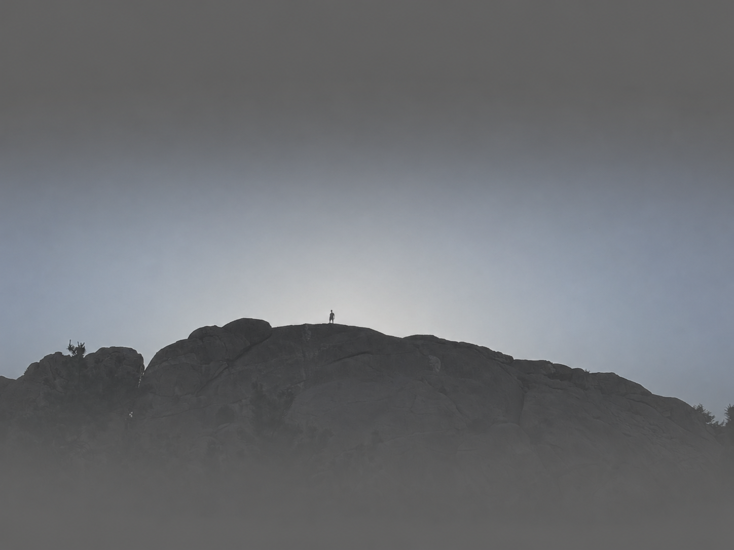 A man standing on a mountain.