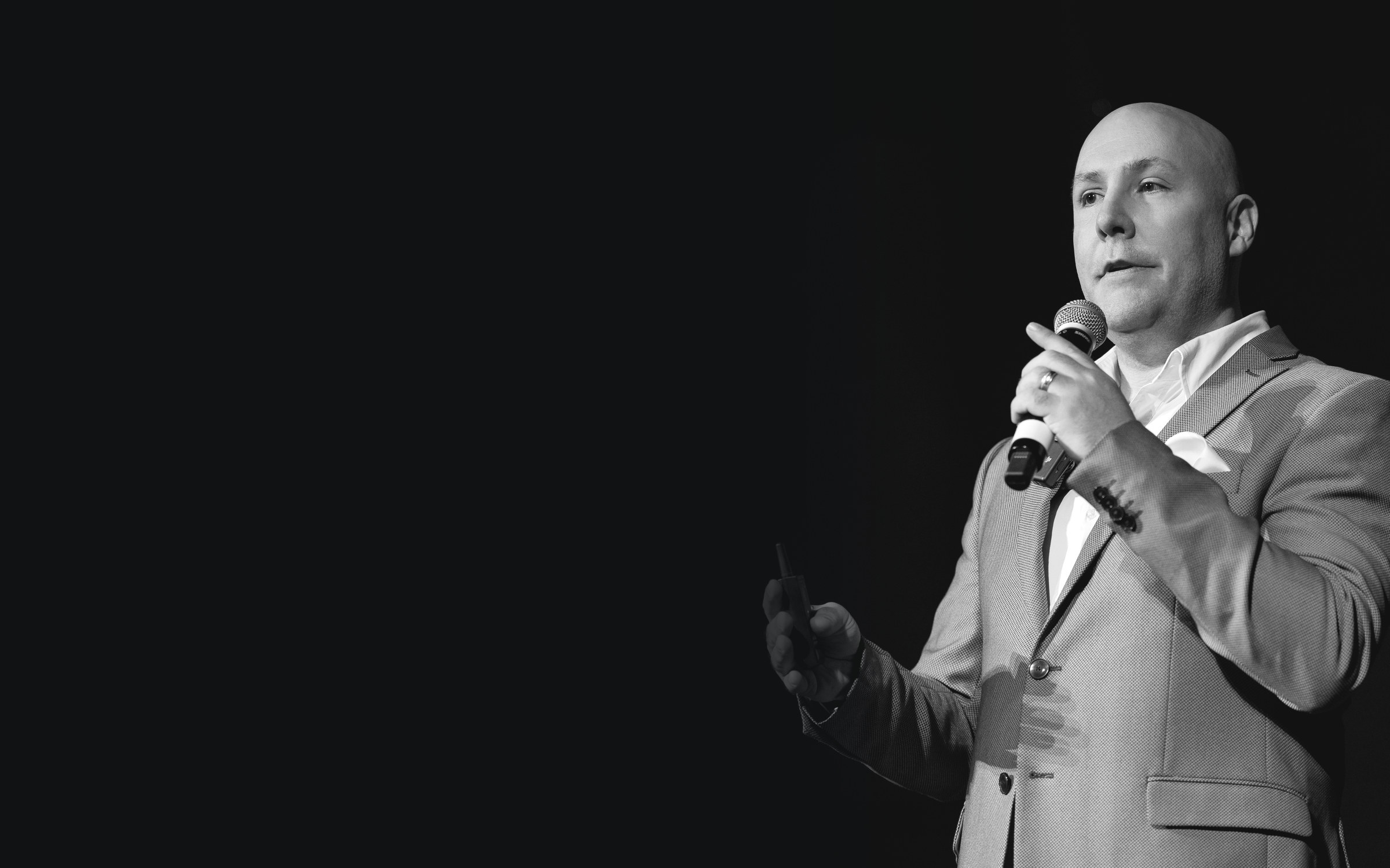 Edward Collins, JD, CFP®, AAMS, RFC, speaking on stage