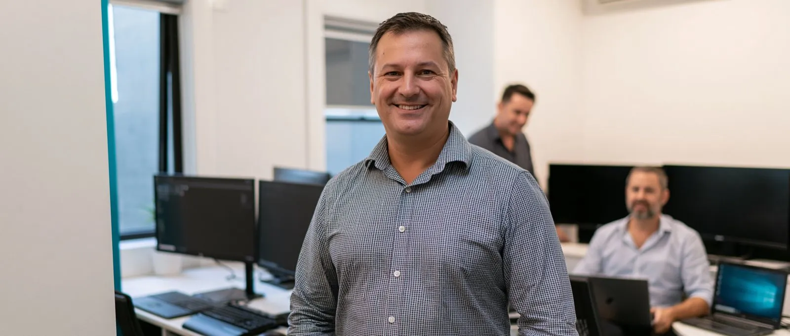 Elscomm project lead in the office with the infrastructure team