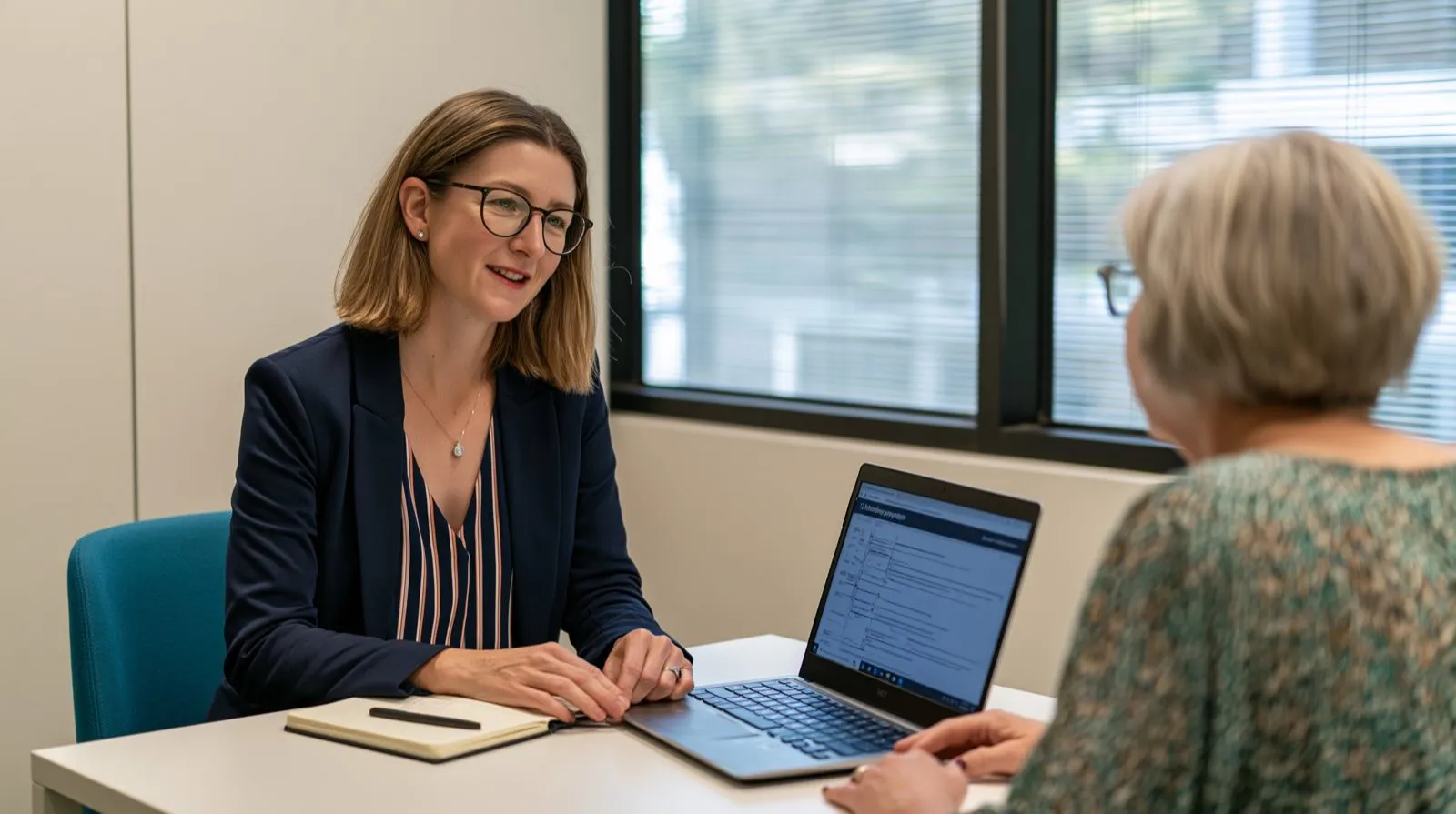 Elscomm consultants meeting with a client over laptops