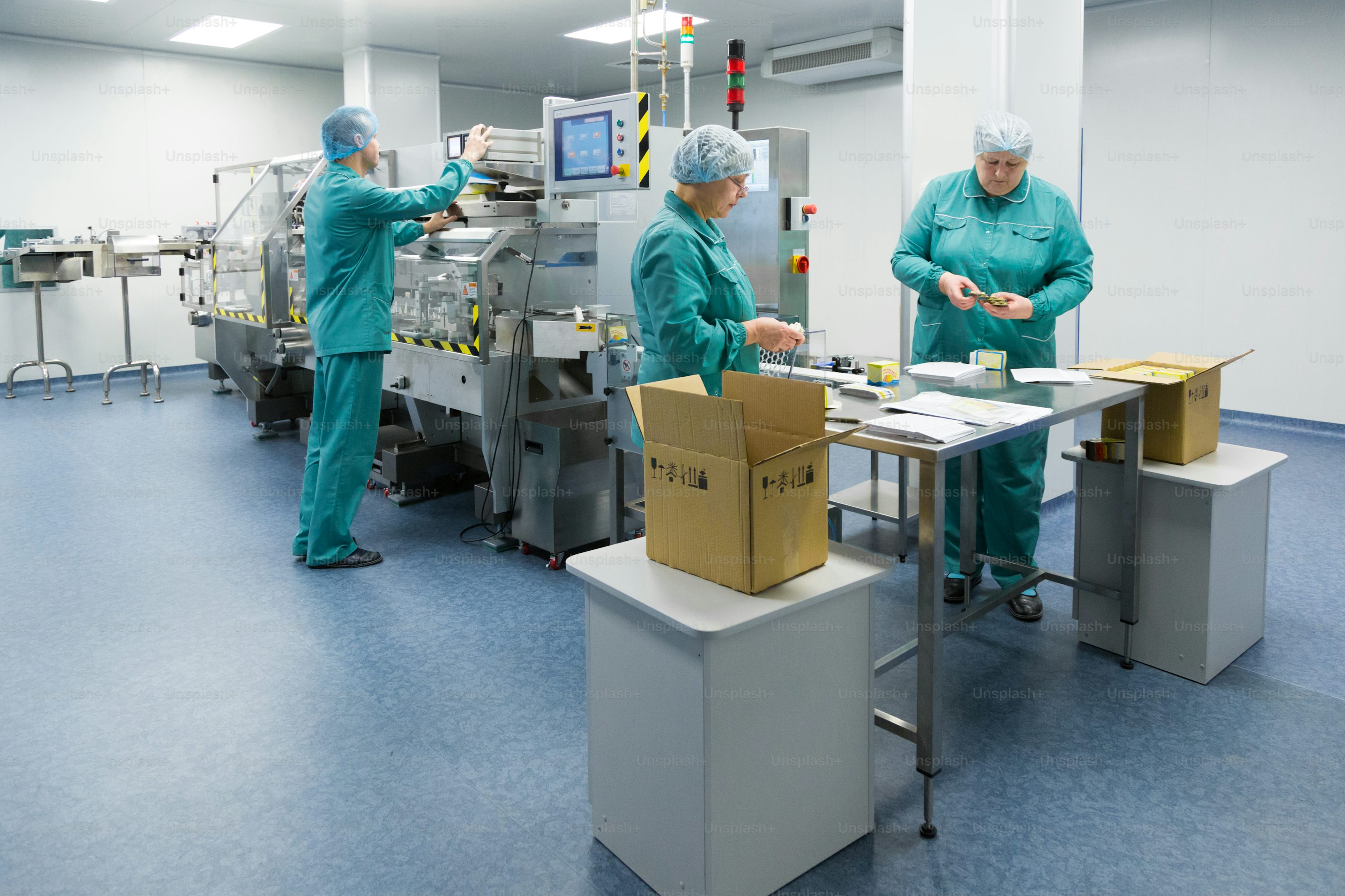 Pharmaceutical operators working at filling line