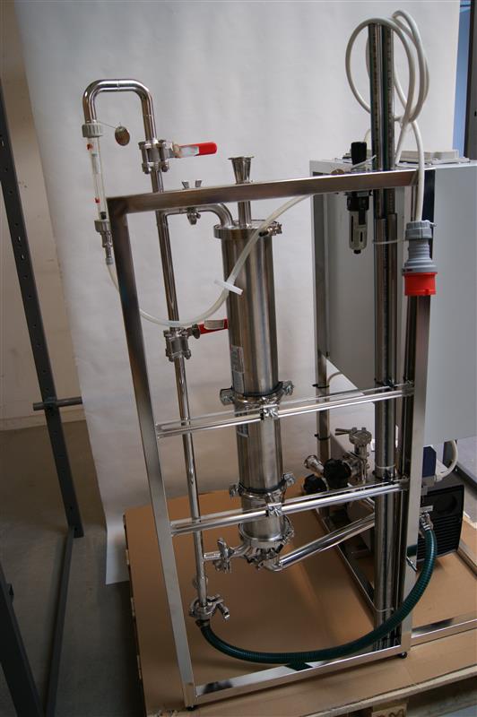 Front view of the membrane degassing skid built by Damgaard Solutions, showing the polypropylene membrane column, sample port, and frame