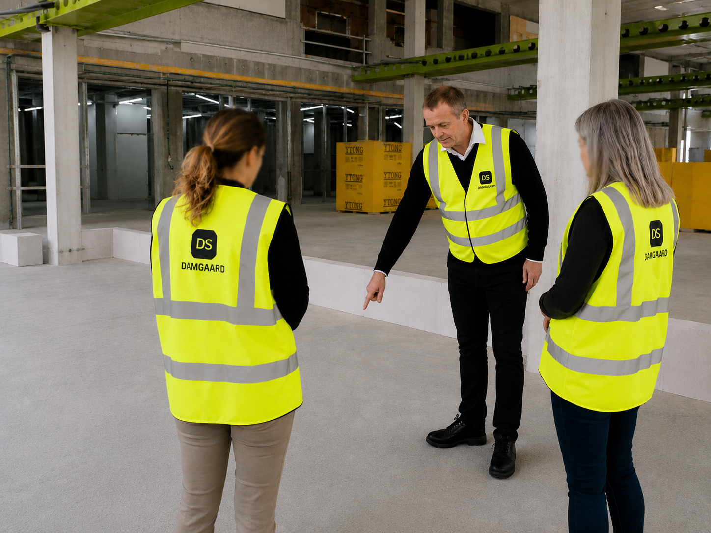 Damgaard Solutions engineers reviewing equipment layout inside a GMP manufacturing facility