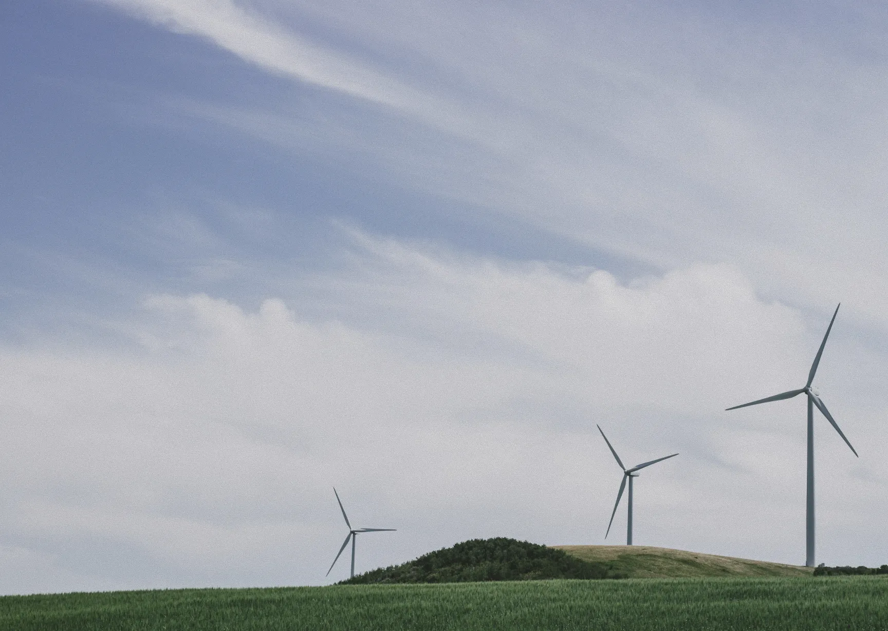 windmills on a grassy field