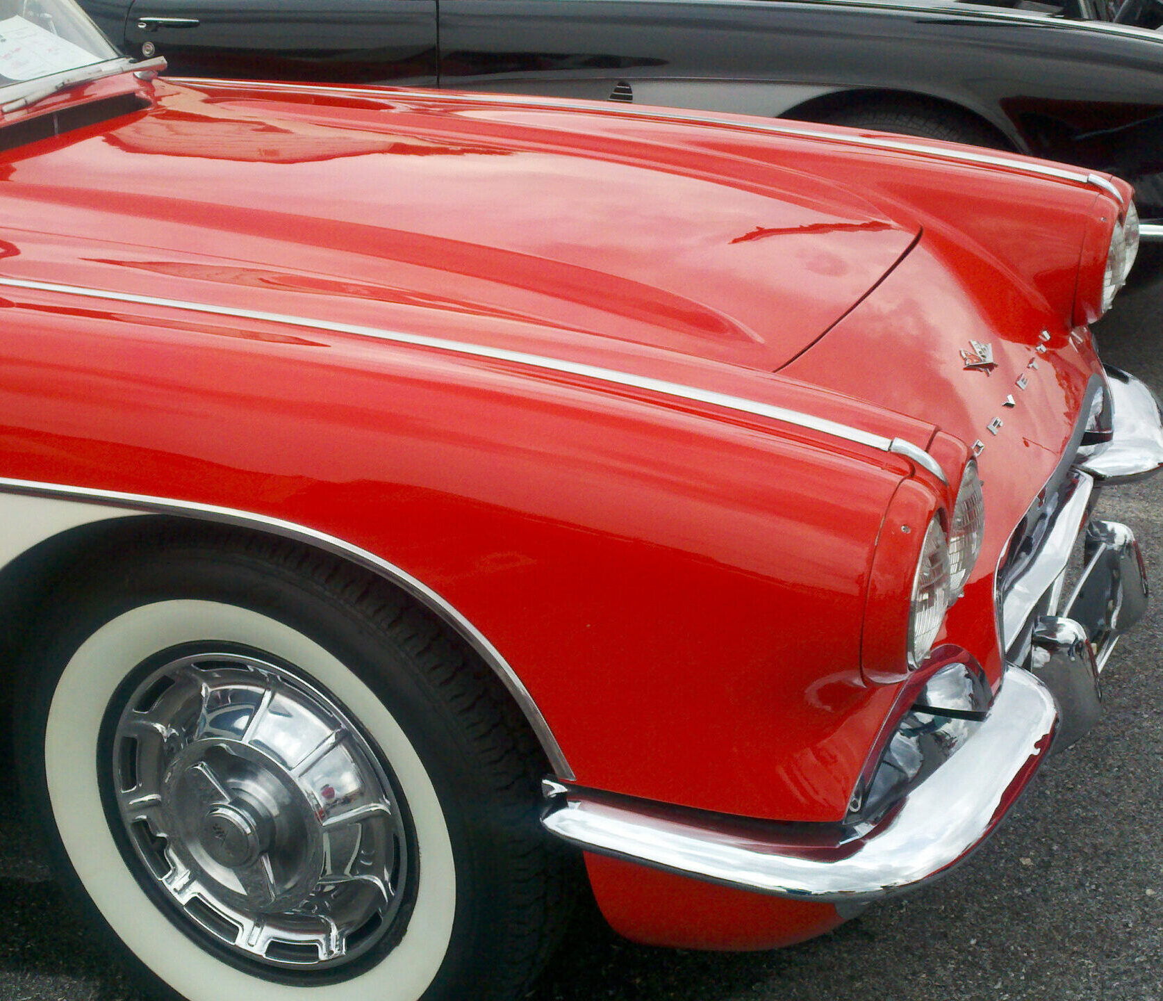 |Red and white vintage Corvette at a car show at the Markets at Shrewsbury in Glen Rock, PA