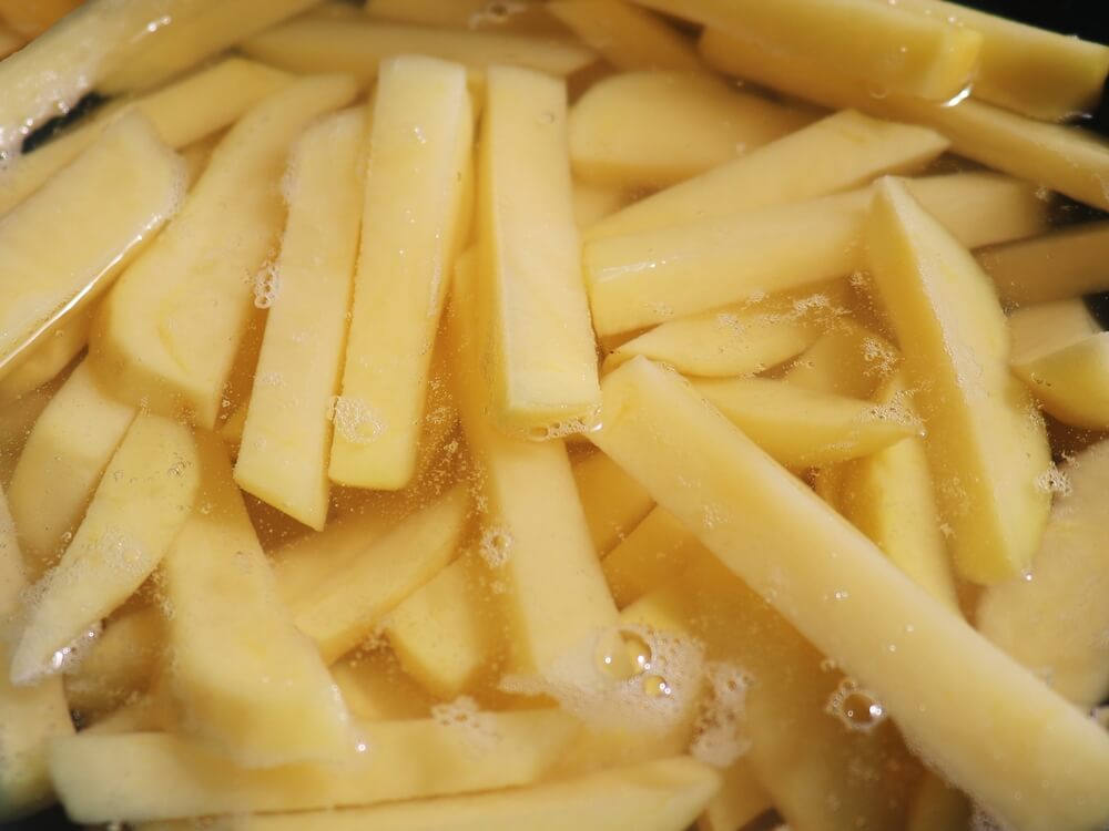 Close-up of a raw Russet potato, known as the best potato for French fries due to its high starch content and low moisture