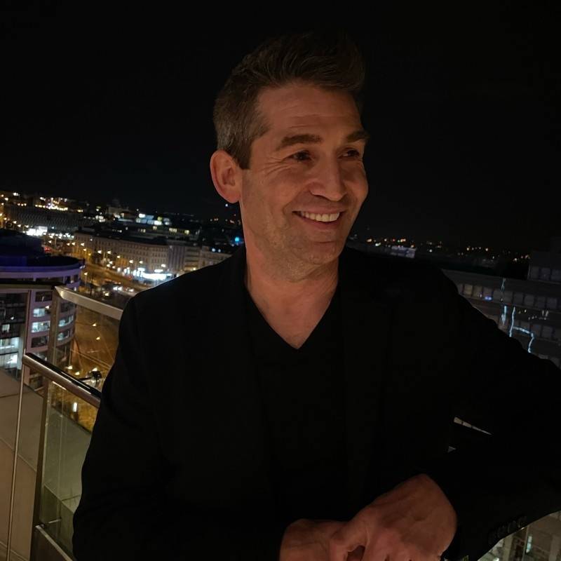 Todd Dunphy portrait with city skyline at night