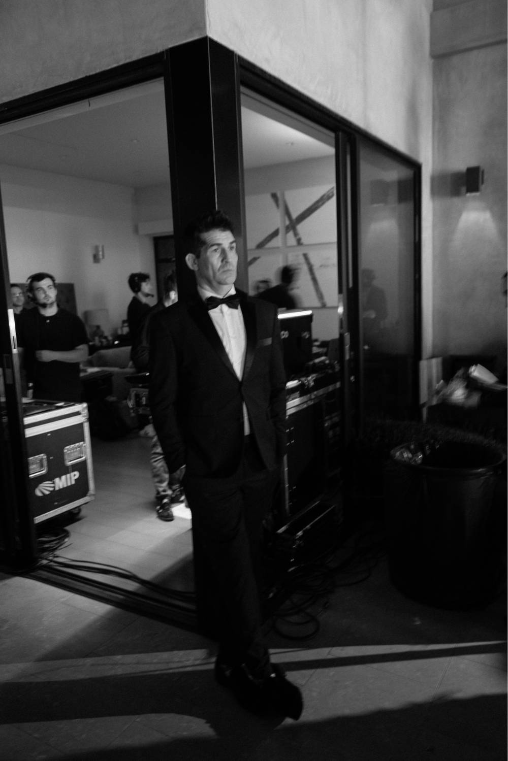 Todd Dunphy backstage in tuxedo, black and white