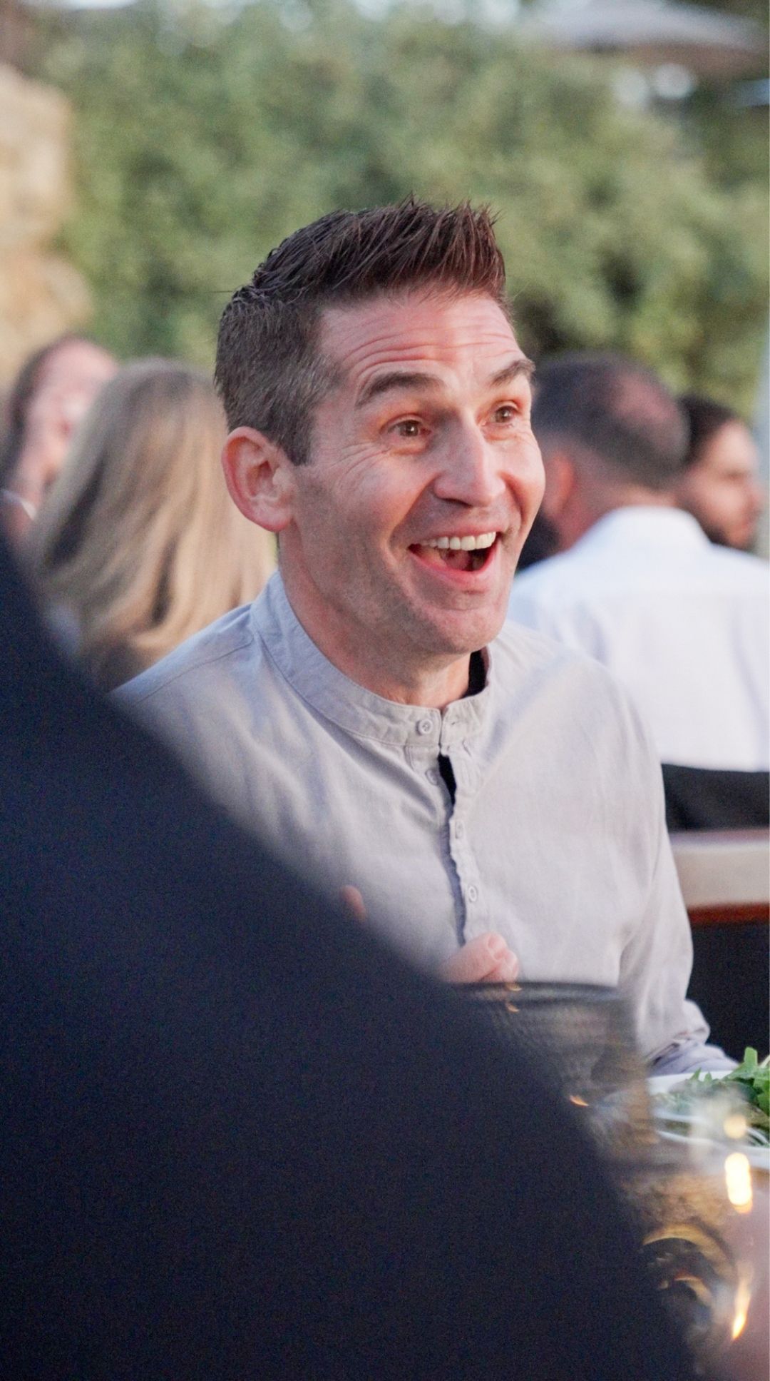 Todd Dunphy at an outdoor Lake Tahoe dinner, mid-laugh