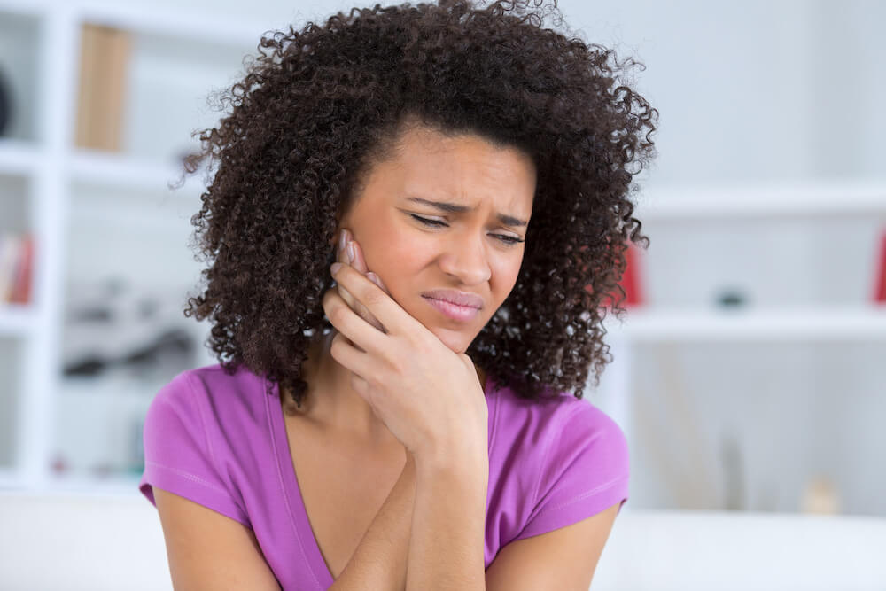 Patient receiving Botox injection in the jaw muscle for TMJ pain relief