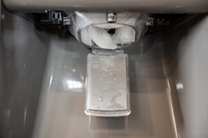 ice cubes clogging ice dispenser 