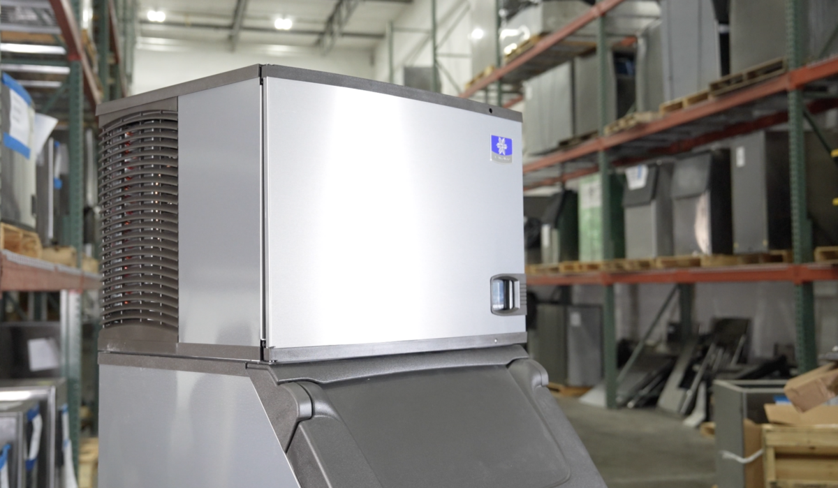 manitowoc ice machine on top of bin in warehouse