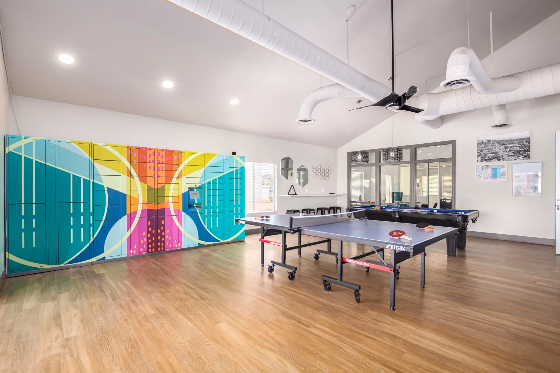 Game room with table tennis and wall mural