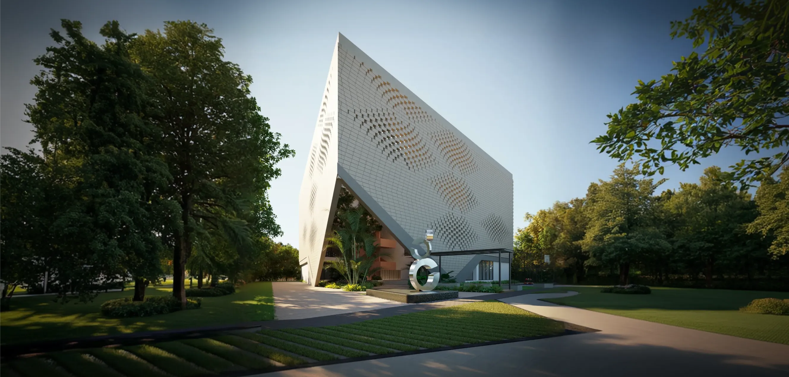 Modern white building with a perforated geometric facade surrounded by green trees and lawn under clear sky.