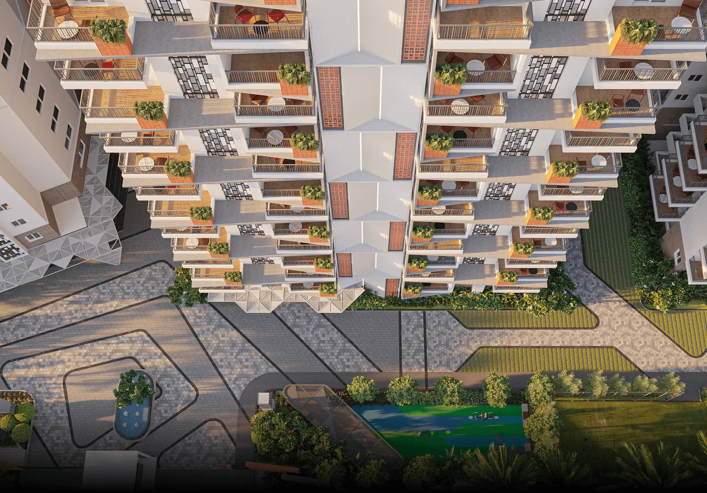 Top-down view of modern apartment balconies with outdoor furniture and plants, overlooking landscaped walkways and green areas.