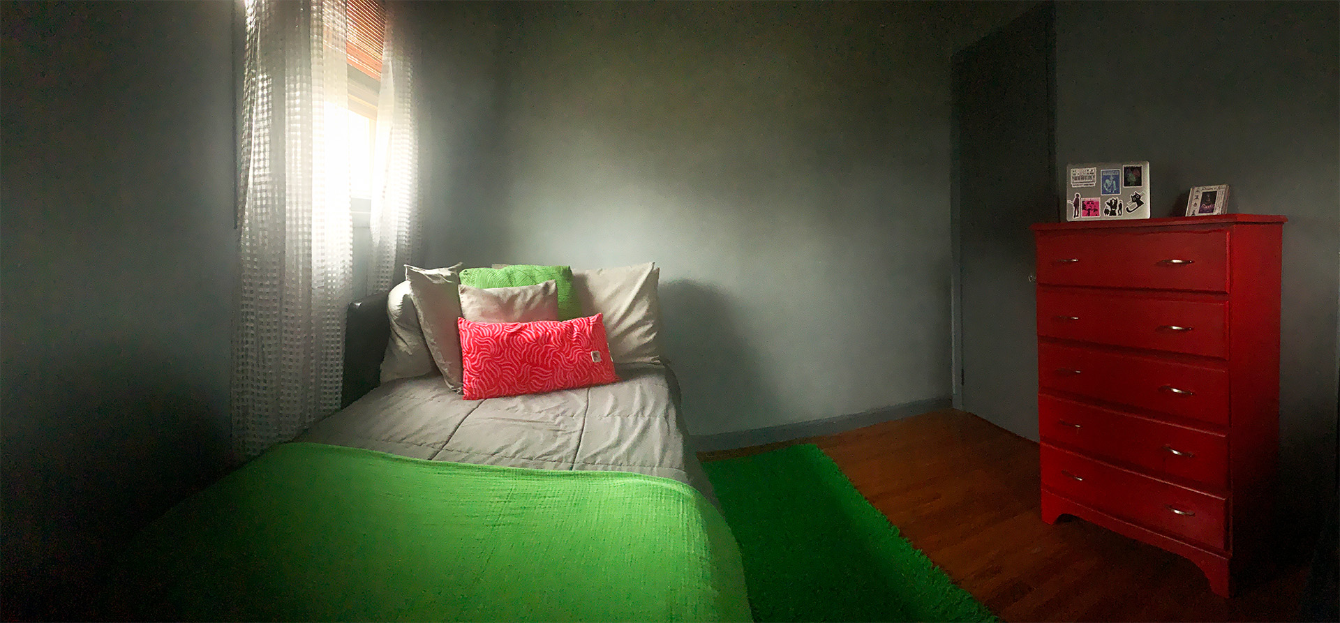 Softly lit bedroom scene with ambient tones.