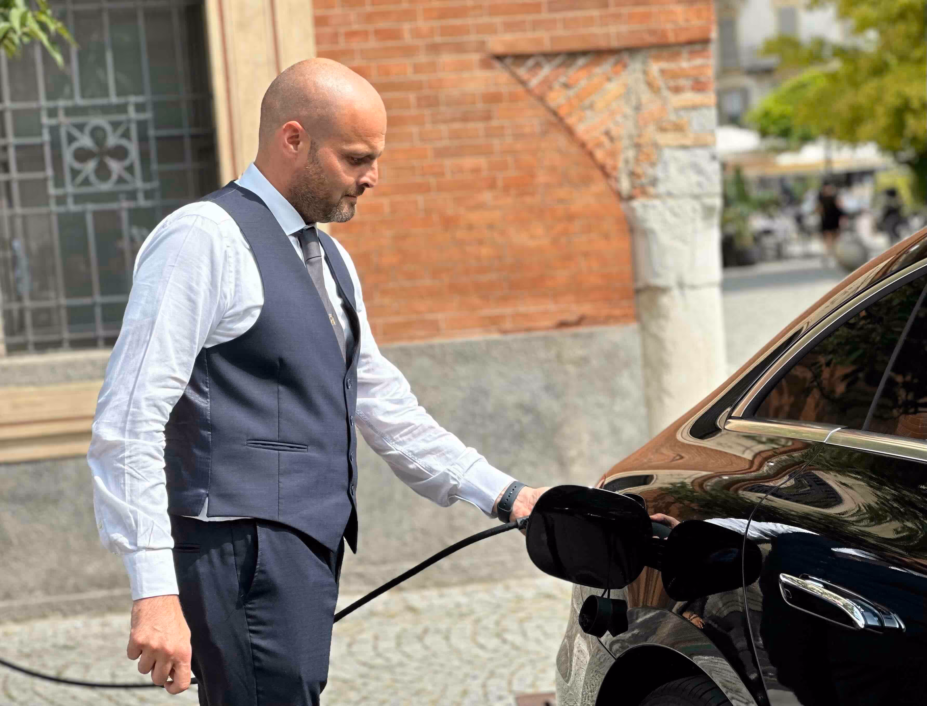 Chauffeur door service with the Mercedes EQE for premium electric private transfers