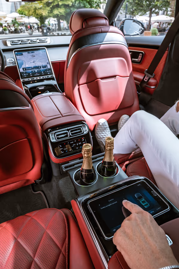 Rear console service inside the Mercedes S-Class with premium passenger amenities